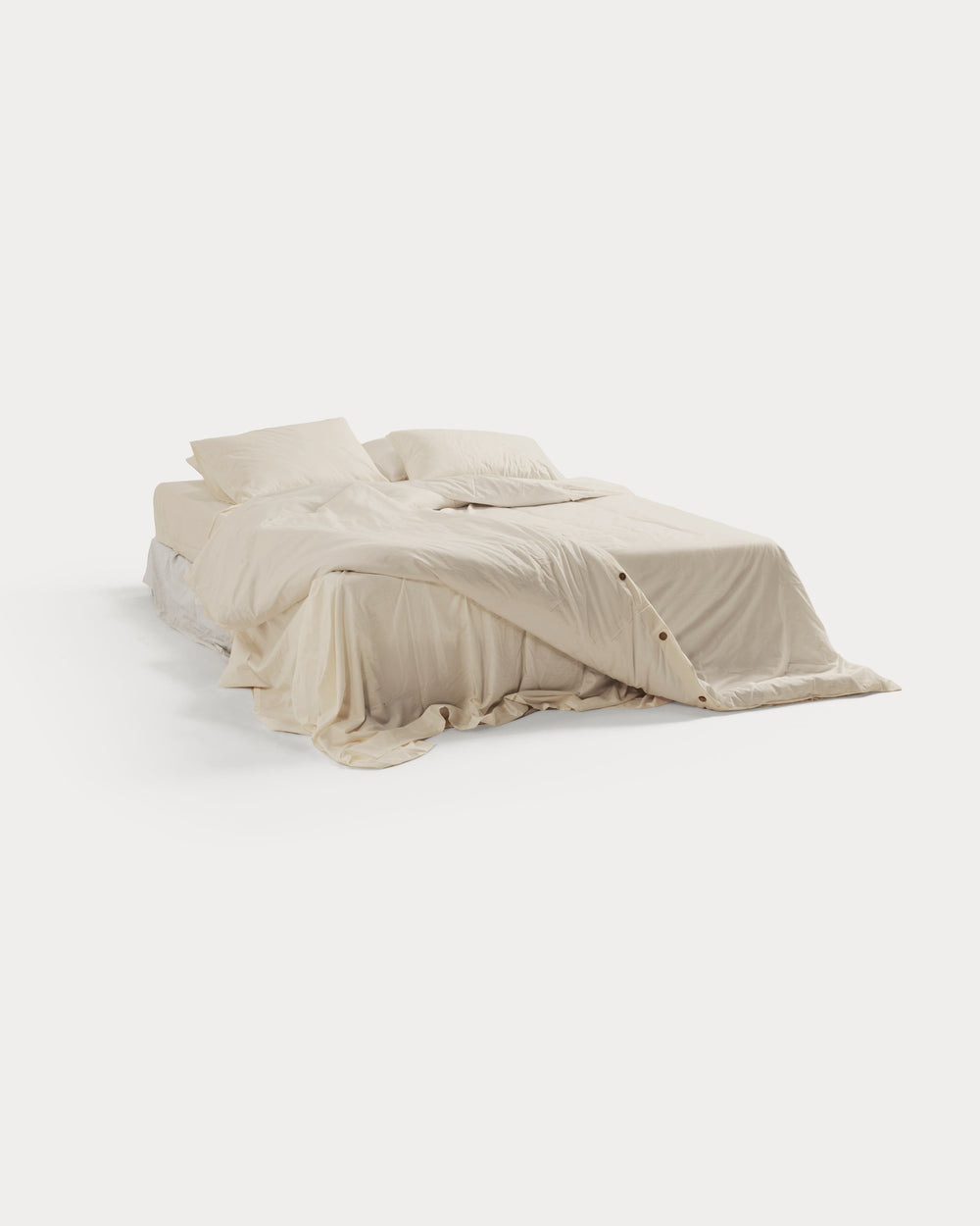 Ivory Egyptian long-staple organic cotton duvet cover on a bed