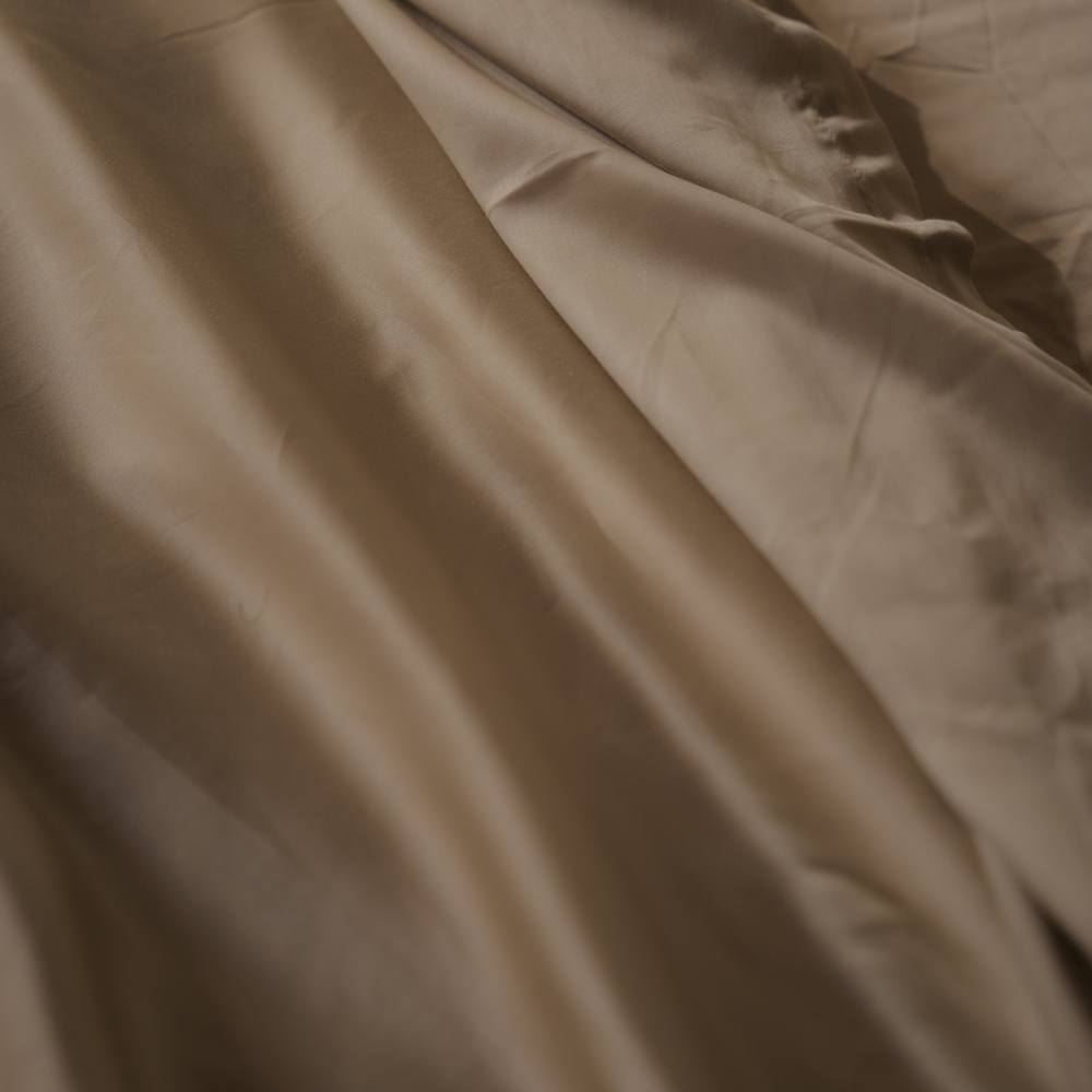 Cream eucalyptus TENCEL sateen, close-up of the fabric