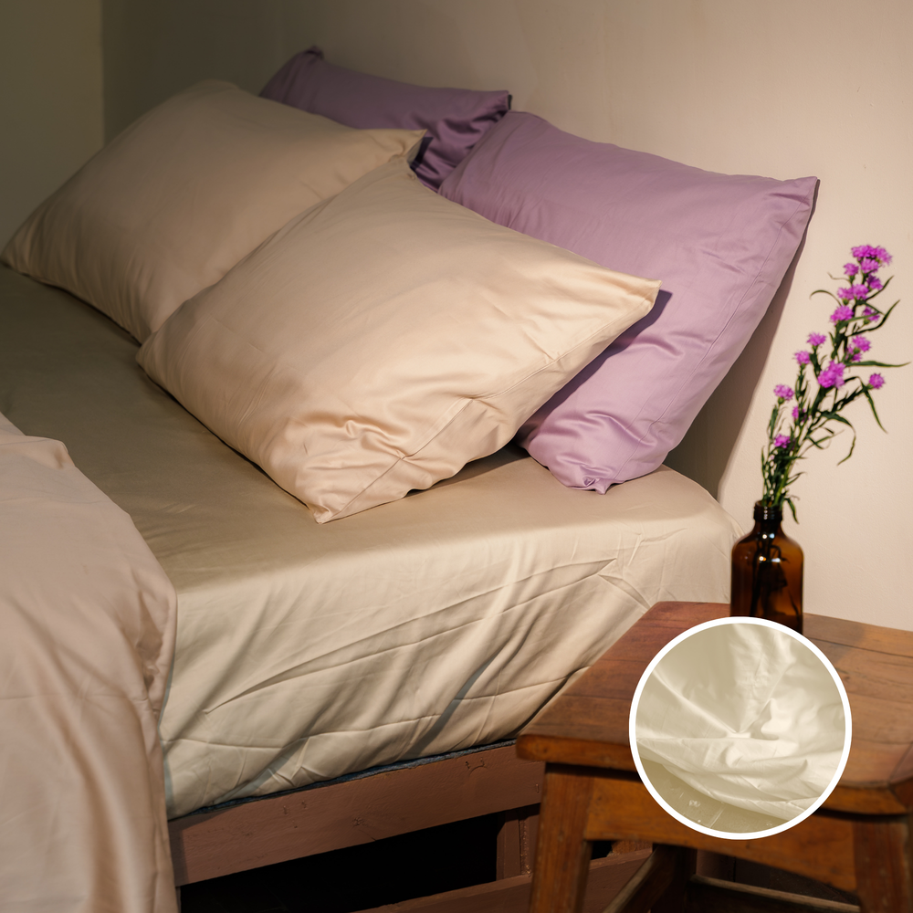 Ivory organic cotton sateen fitted sheet, labelled, with a close-up of the fabric