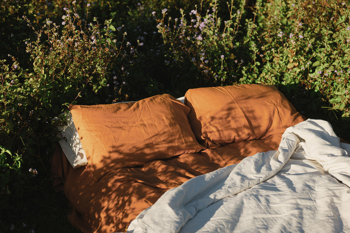 A made bed in French flax linen from The Katha